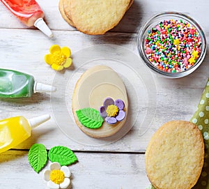 Cookies with decorations tools Ã¢â¬â icing, marzipan flower, nonpareil